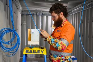 Qualified-industrial-electrician-in-mebourne-works-on-large-scale-automation-project-Teoma-Group